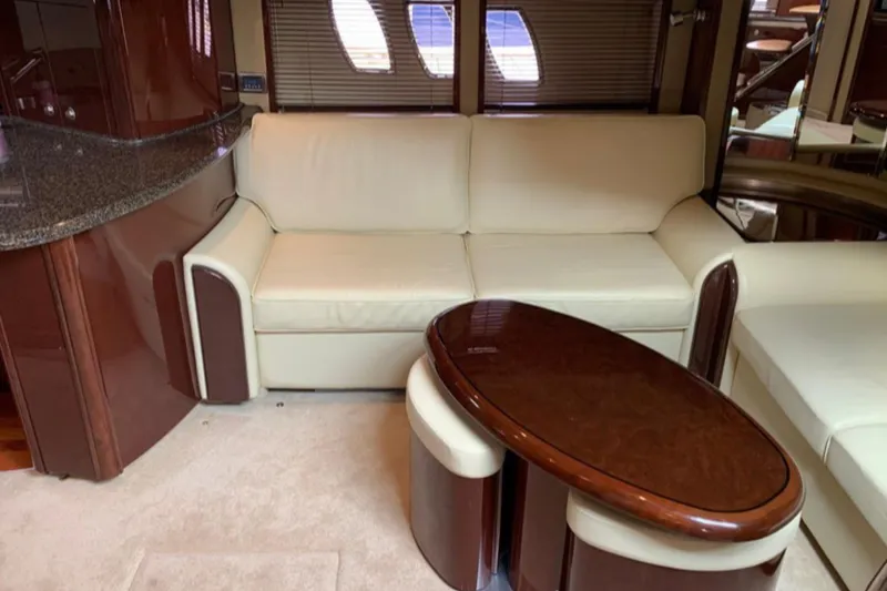 Slide: The Image of Luxurious interior of 2007 Sea Ray 52 Sundancer yacht with cream sofa and wooden table. - 8