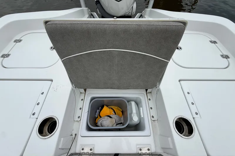 Slide: The Image of 2025 Sea Hunt BX25FS boat interior with storage compartment and seating. - 31