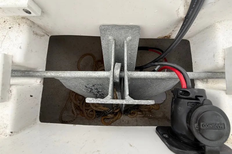 Slide: The Image of Anchor compartment of 2025 Sea Hunt BX25FS boat with ropes and cables. - 34