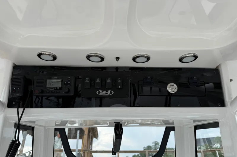 Slide: The Image of 2025 Sea Hunt BX25FS boat console with Garmin radio and control panel. - 14