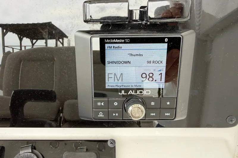 Slide: The Image of JL Audio MediaMaster 50 on Sea Hunt BX25FS boat, tuned to 98.1 FM. - 11