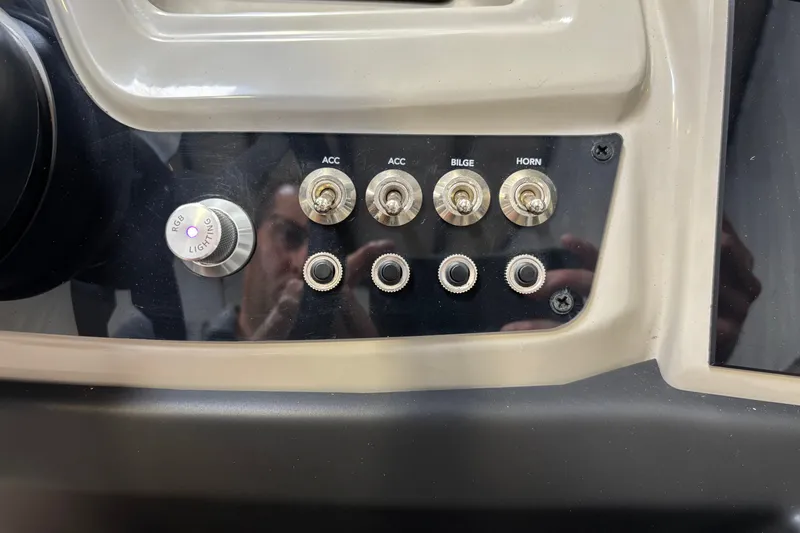 Slide: The Image of Control panel of 2023 Barletta Cabrio 22QC with switches and RGB lighting knob. - 16