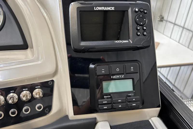 Slide: The Image of Control panel of 2023 Barletta Cabrio 22QC with Lowrance and Hertz systems. - 17