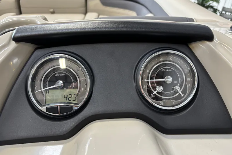 Slide: The Image of Dashboard of 2023 Barletta Cabrio 22QC showing RPM and speed gauges. - 14