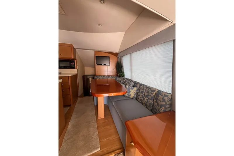 Slide: The Image of Interior of 2004 Ocean Yacht 52 Super Sport with dining area and TV. - 10