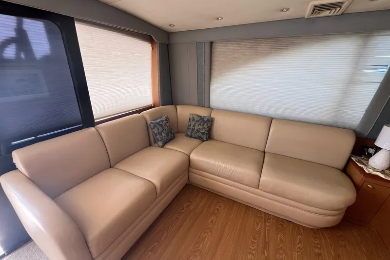 Slide: The Image of Luxurious beige leather sofa in 2004 Ocean Yacht 52 Super Sport interior. - 2