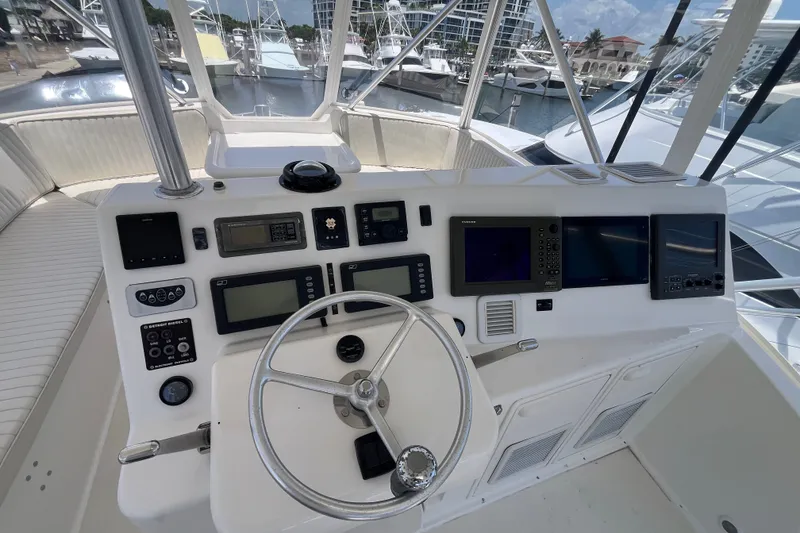 Slide: The Image of Cockpit of 2004 Ocean Yacht 52 Super Sport with navigation instruments and steering wheel. - 26