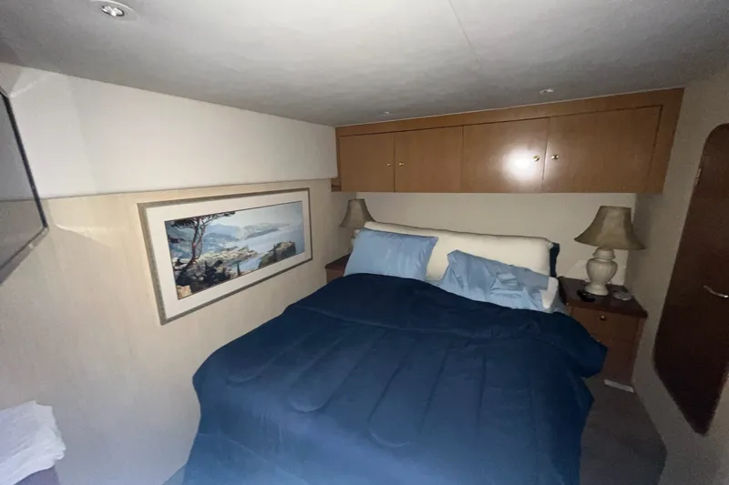 Slide: The Image of Luxurious bedroom interior of 2004 Ocean Yacht 52 Super Sport with cozy bedding and elegant decor. - 17