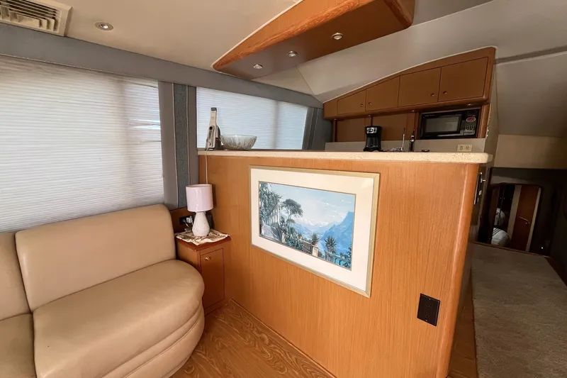Slide: The Image of Interior of 2004 Ocean Yacht 52 Super Sport with cozy seating and kitchenette. - 3