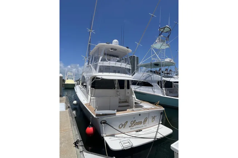 Slide: The Image of 2004 Ocean Yacht 52 Super Sport docked under clear blue sky. - 18