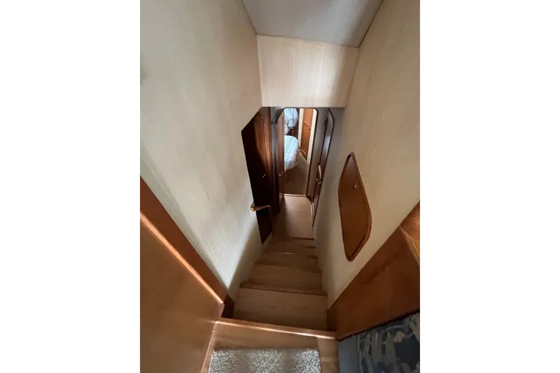 Slide: The Image of Staircase inside 2004 Ocean Yacht 52 Super Sport, leading to cabin area. - 11