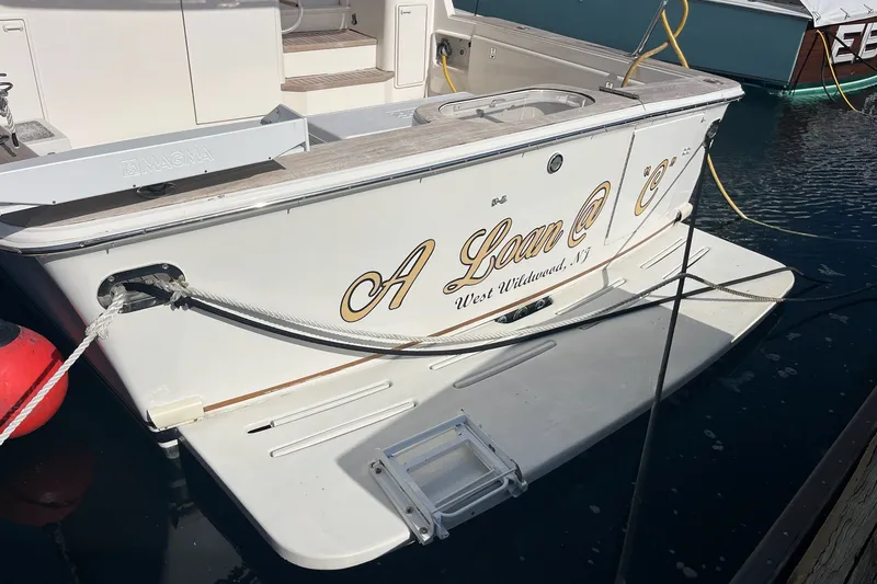 Slide: The Image of 2004 Ocean Yacht 52 Super Sport docked, featuring "A Loan @ C" nameplate. - 21