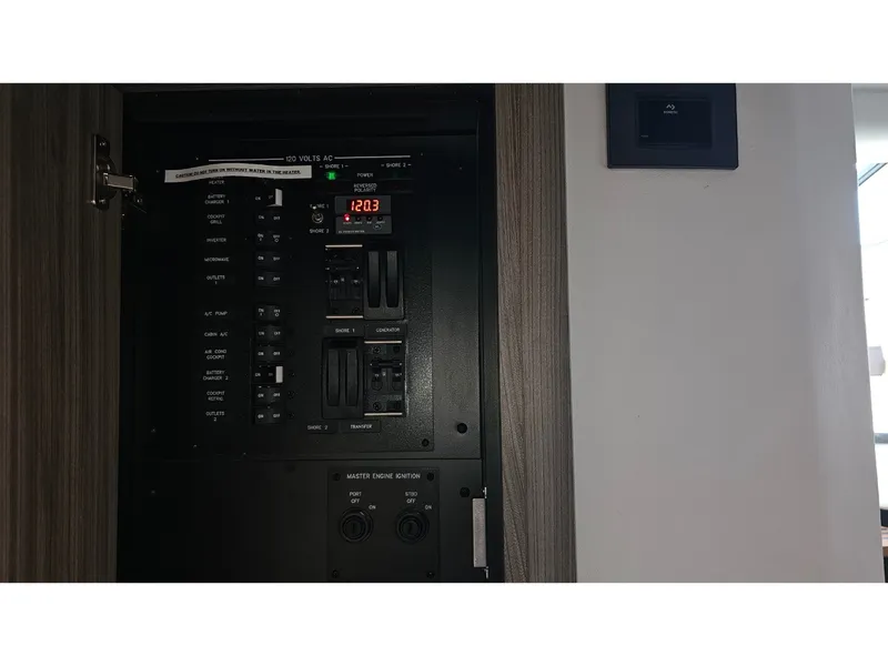 Slide: The Image of Electrical control panel in a 2026 Sea Ray Sundancer 320 Coupe Outboard. - 19