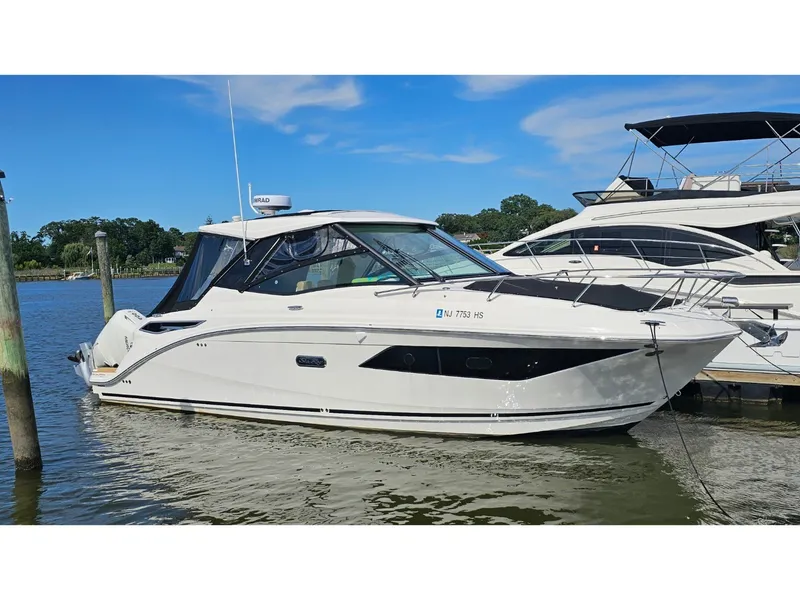 Slide: The Image of Sea Ray Sundancer 320 Coupe Outboard 2026 docked, featuring sleek design and modern lines. - 0