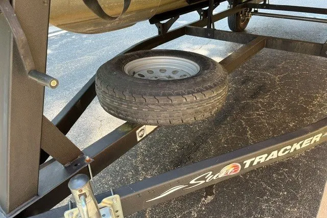Slide: The Image of Trailer for 2021 Sun Tracker Bass Buggy 18 DLX with spare tire attached. - 22