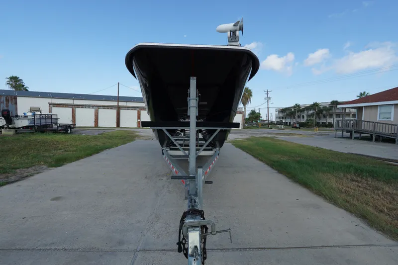 Slide: The Image of 2014 AmeraCat 31 boat on trailer, parked outdoors on a sunny day. - 6