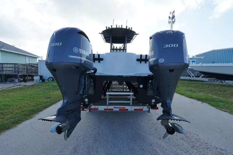 Slide: The Image of 2014 AmeraCat 31 boat with dual Yamaha 300 engines on a trailer. - 2