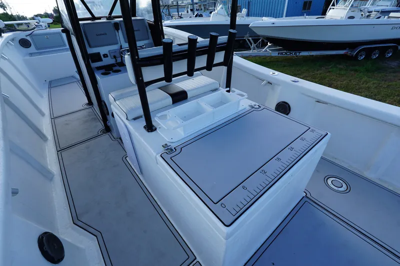Slide: The Image of 2014 AmeraCat 31 boat interior with fishing rod holders and measuring board. - 11