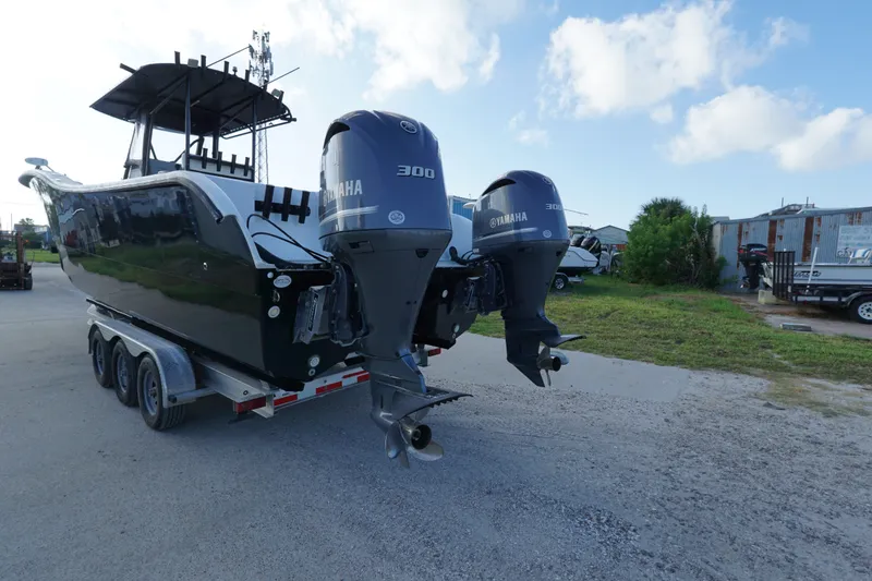 Slide: The Image of 2014 AmeraCat 31 boat with dual Yamaha 300 engines on a trailer. - 3