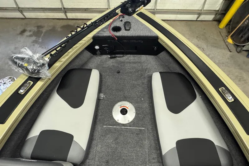 Slide: The Image of Interior of 2027 Tracker Targa V-18 Combo boat with seating and storage compartments. - 20