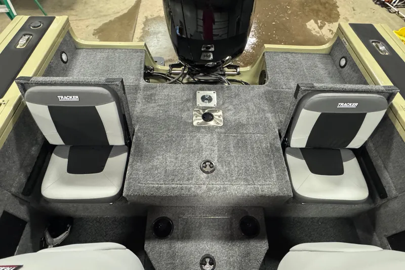 Slide: The Image of 2027 Tracker Targa V-18 Combo boat interior with gray seating and motor. - 14