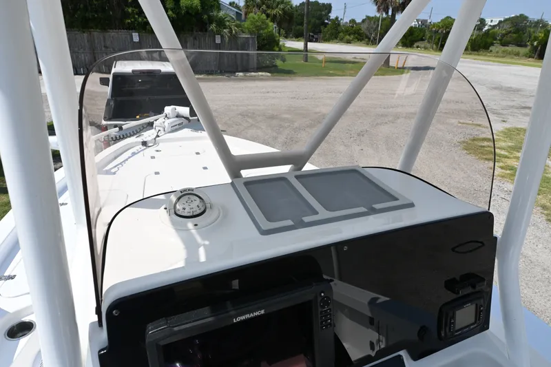 Slide: The Image of 2018 Sea Hunt BX22BR boat dashboard with compass and navigation equipment. - 9