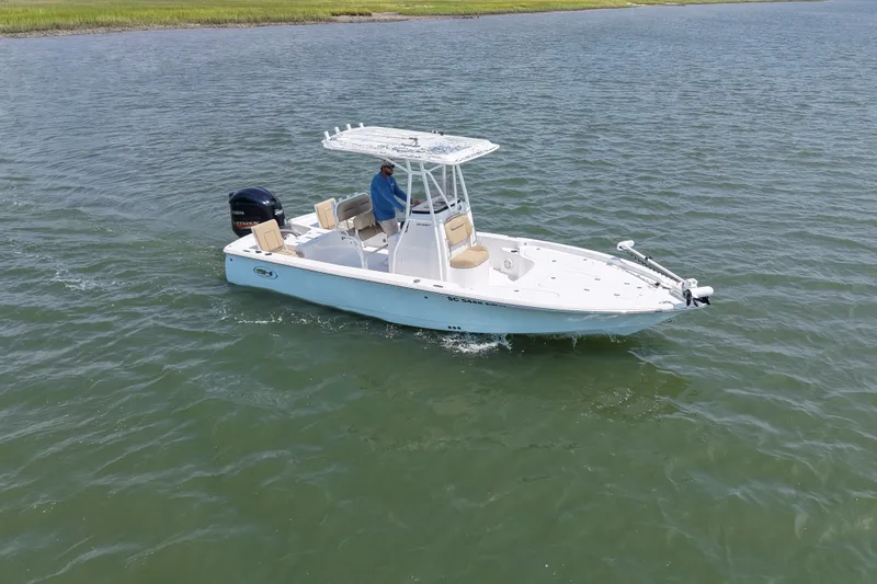 Slide: The Image of 2018 Sea Hunt BX22BR boat cruising on calm waters. - 4