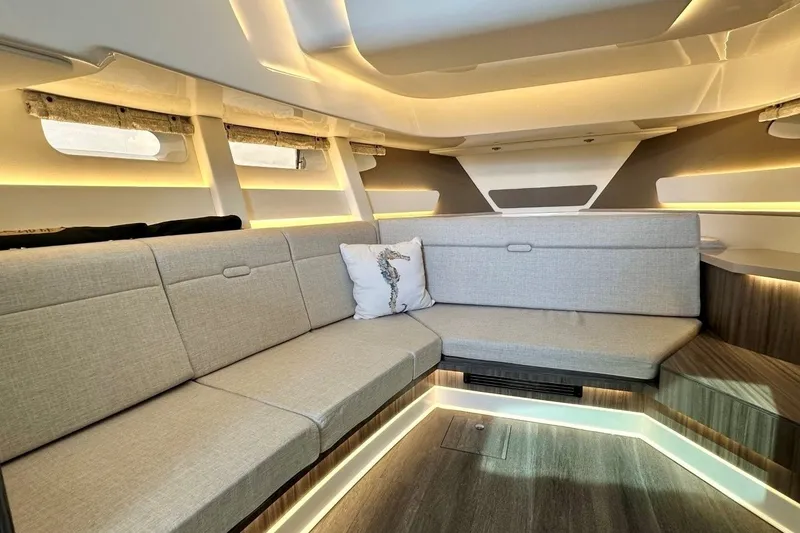 Slide: The Image of Luxurious interior of 2022 Sea Ray Sundancer 370 Outboard with modern seating and ambient lighting. - 19