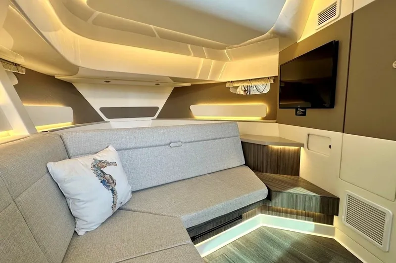 Slide: The Image of Luxurious interior of 2022 Sea Ray Sundancer 370 Outboard with modern seating and ambient lighting. - 20