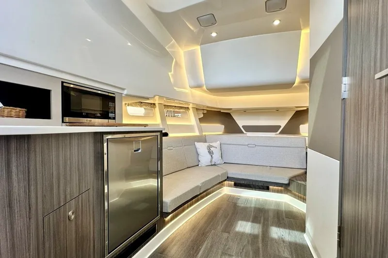 Slide: The Image of Luxurious interior of 2022 Sea Ray Sundancer 370 Outboard with modern seating and kitchenette. - 18