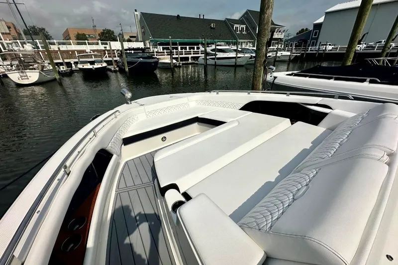 Slide: The Image of 2022 Sea Ray Sundancer 370 Outboard at marina, featuring luxurious seating and sleek design. - 4