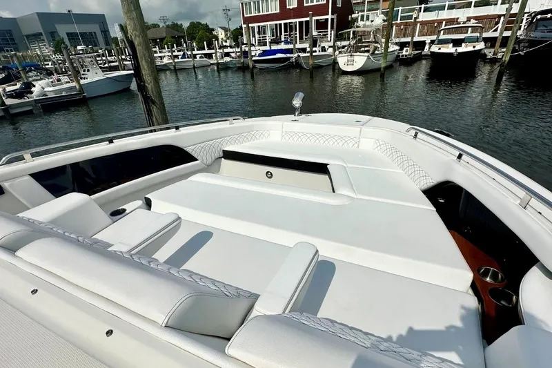 Slide: The Image of 2022 Sea Ray Sundancer 370 Outboard boat with luxurious seating at a marina. - 5