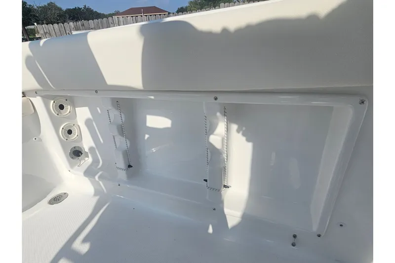 Slide: The Image of Interior view of a 2027 Sea Hunt Ultra 219 boat, showcasing storage compartments. - 33