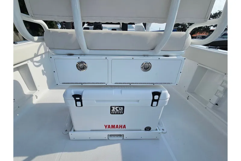 Slide: The Image of Interior of 2027 Sea Hunt Ultra 219 boat with storage and cooler. - 17