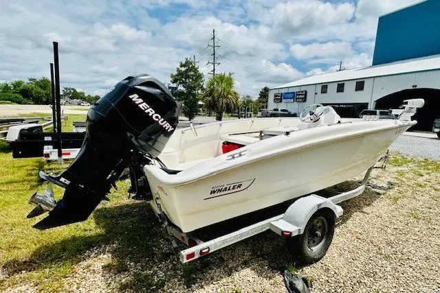 Slide: The Image of 2011 Boston Whaler 170 Super Sport boat with Mercury engine on trailer. - 1