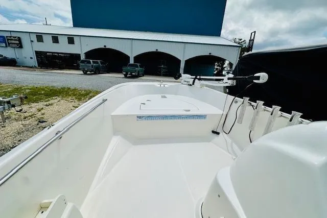 Slide: The Image of 2011 Boston Whaler 170 Super Sport boat interior with open deck and storage compartments. - 8
