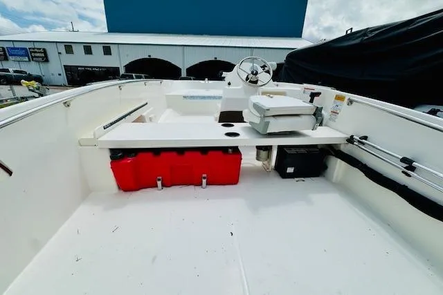 Slide: The Image of 2011 Boston Whaler 170 Super Sport boat interior with steering console and seating. - 5