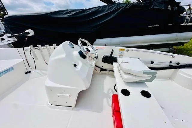 Slide: The Image of 2011 Boston Whaler 170 Super Sport boat interior with steering console and seating. - 7