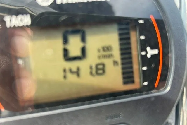 Slide: The Image of Close-up of a 2016 Scout 177 Sport tachometer displaying 1418 hours. - 11