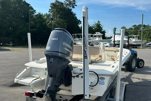 Slide: The Image of 2016 Scout 177 Sport boat with Yamaha 90 engine on trailer in parking lot. - 7