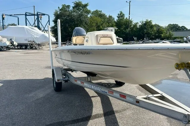 Slide: The Image of 2016 Scout 177 Sport boat on trailer in outdoor setting. - 9