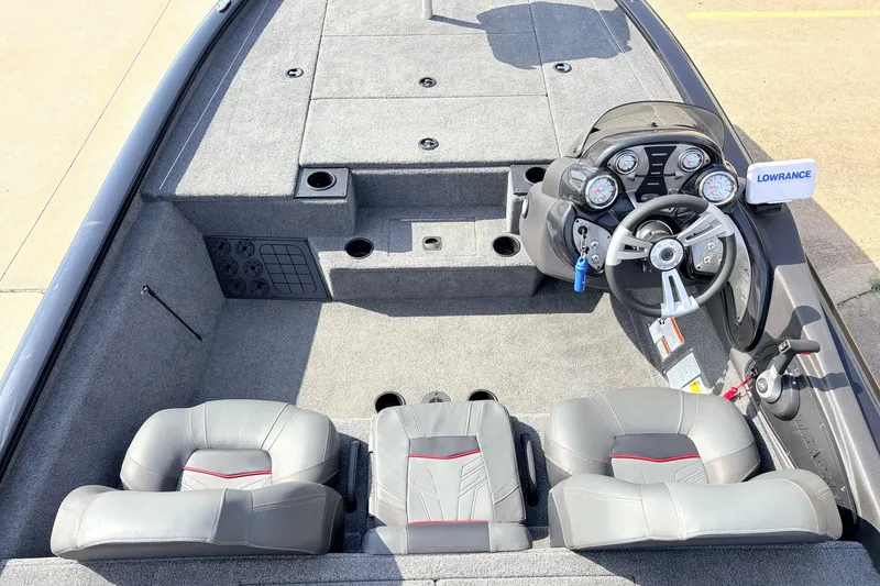 Slide: The Image of 2024 Tracker Pro Team 195 TXW Tournament Edition boat interior with steering console and seating. - 26