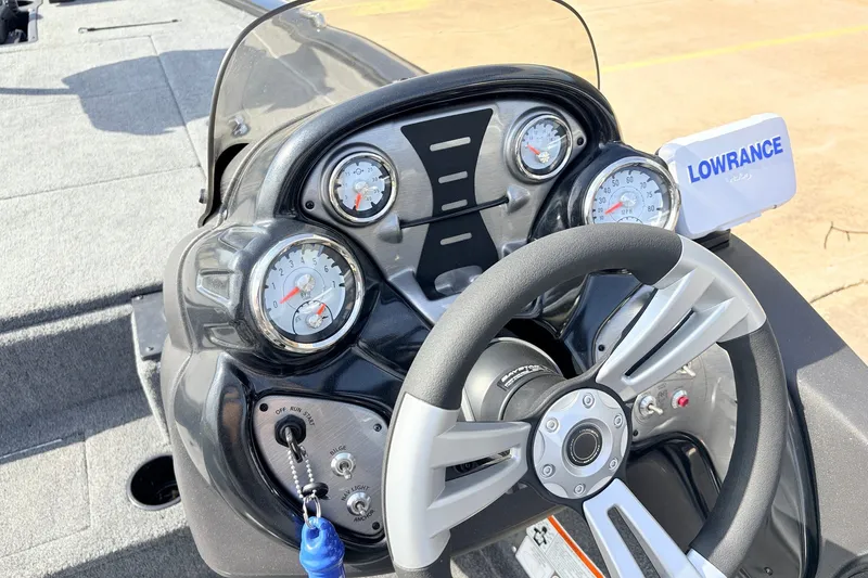 Slide: The Image of 2024 Tracker Pro Team 195 TXW Tournament Edition dashboard with gauges and Lowrance display. - 30