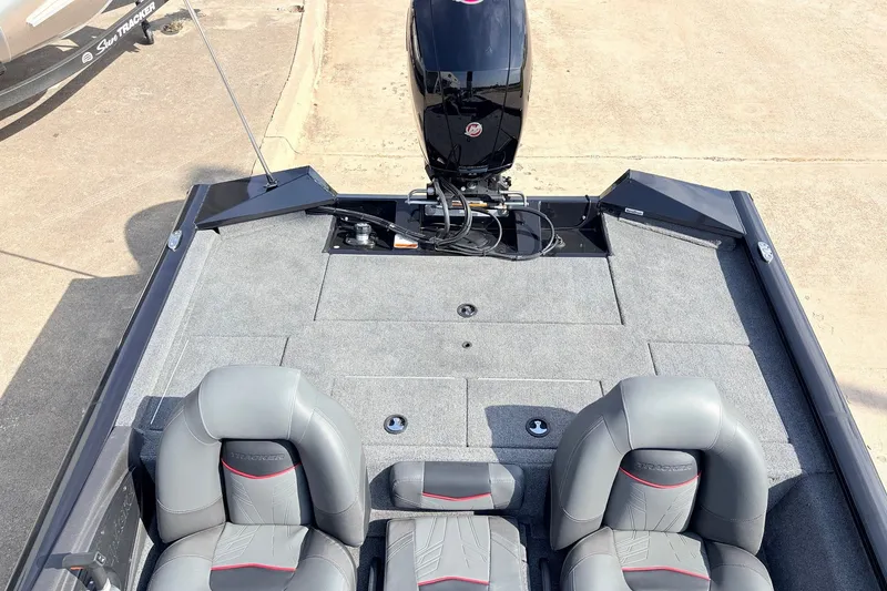 Slide: The Image of 2024 Tracker Pro Team 195 TXW Tournament Edition boat interior with seating and motor. - 33