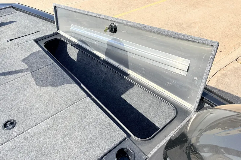 Slide: The Image of Open storage compartment on 2024 Tracker Pro Team 195 TXW Tournament Edition boat. - 21