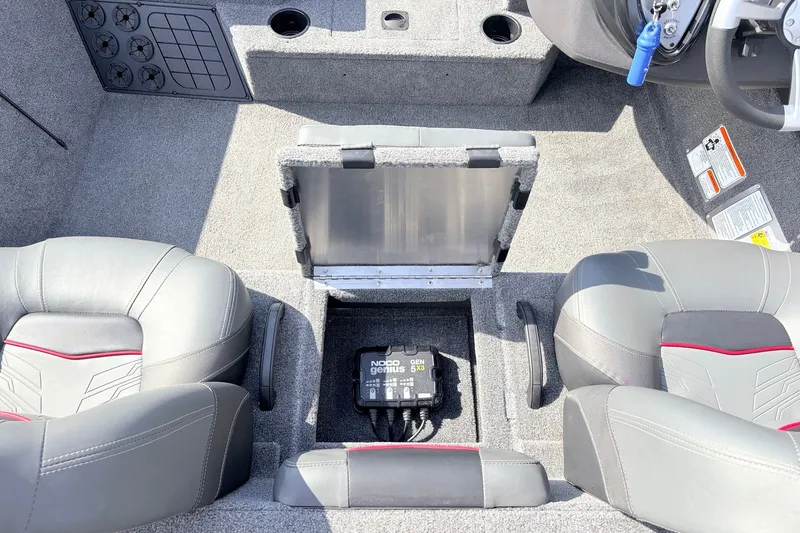Slide: The Image of 2024 Tracker Pro Team 195 TXW Tournament Edition boat interior with storage compartment open. - 27