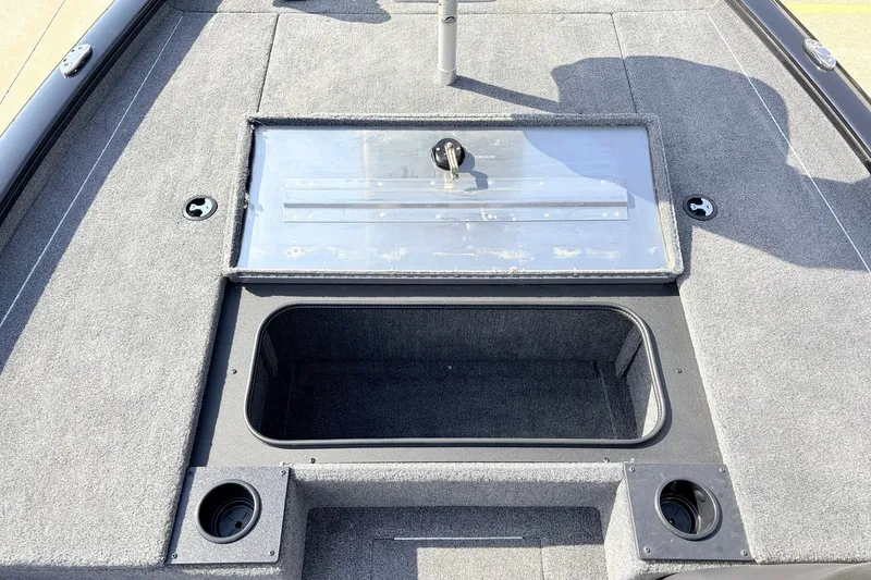 Slide: The Image of 2024 Tracker Pro Team 195 TXW Tournament Edition boat deck with storage compartment. - 19