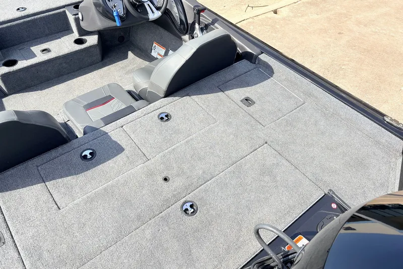 Slide: The Image of 2024 Tracker Pro Team 195 TXW Tournament Edition boat interior with gray seating and storage. - 40
