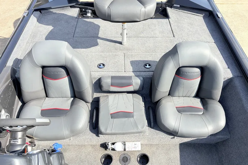 Slide: The Image of 2024 Tracker Pro Team 195 TXW Tournament Edition boat interior with gray seating and carpet. - 25