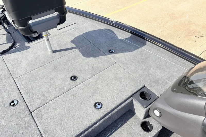 Slide: The Image of 2024 Tracker Pro Team 195 TXW Tournament Edition boat deck with seating and storage compartments. - 15